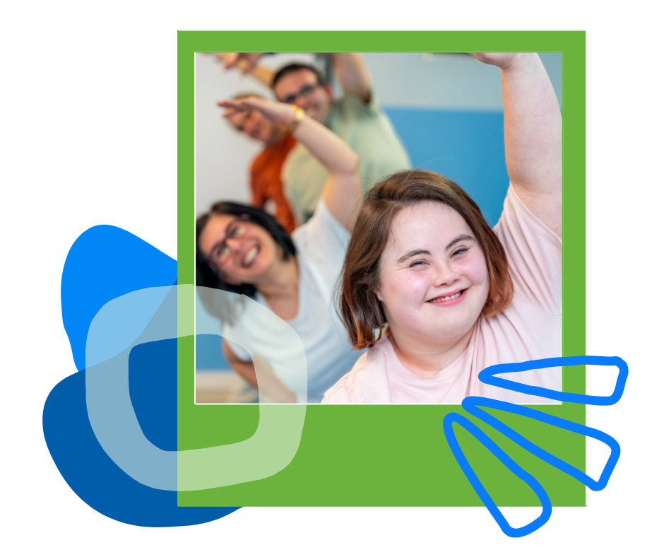 Adults stretching together in a group fitness class, a smiling woman in front