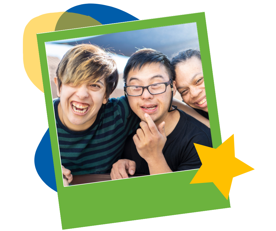 Three friends leaning in close and laughing together